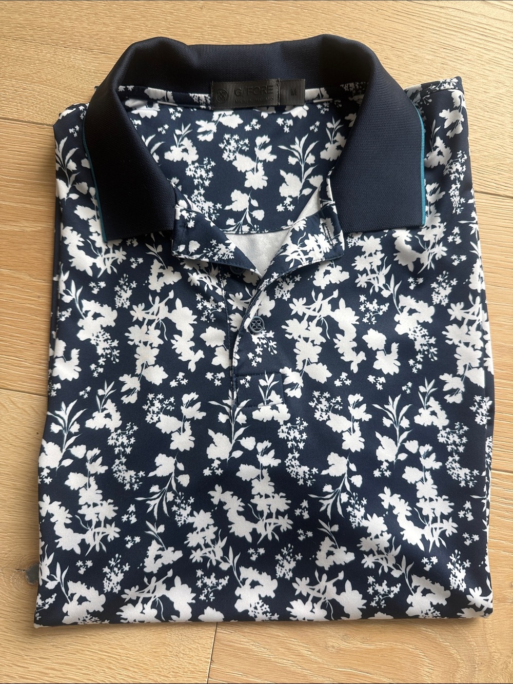 G/FORE Navy Polo with White Floral Print and Contrast Collar